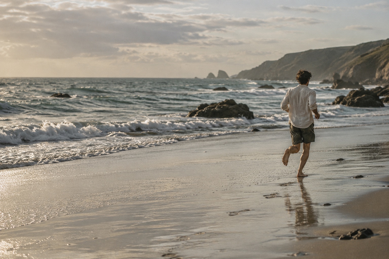 A runner on the coast in soft evening light